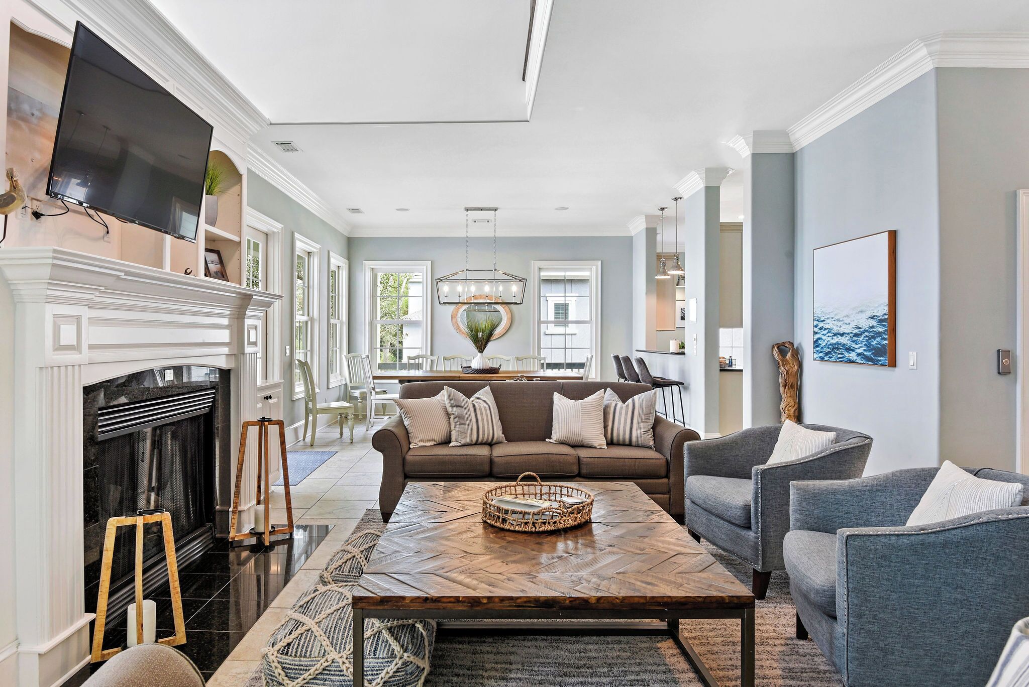 A spacious living room with a fireplace, a large sofa, and a coffee table.