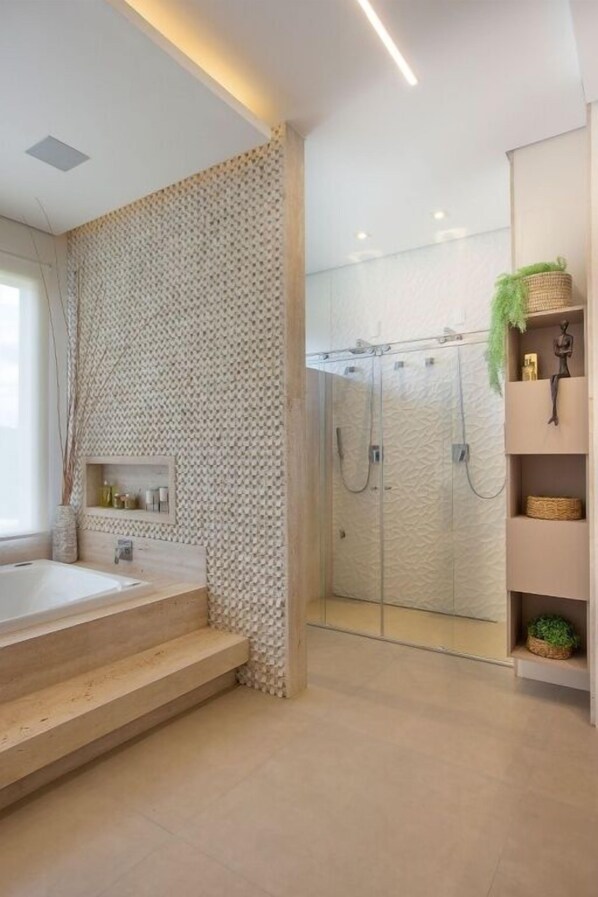 A modern bathroom with a glass-enclosed shower, a large bathtub, and a wooden vanity. - Casa Mantiqueira Hotel Boutique (Jacutinga)