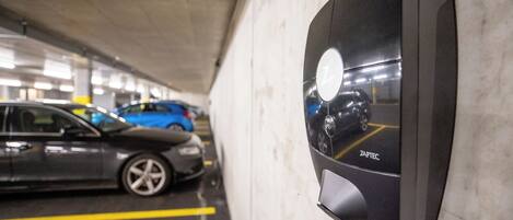 A parking garage with a ZAPTEC parking meter.