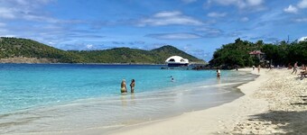 New listing! Easy walk to 3 separate Beaches, Pool, and multiple Restaurants!