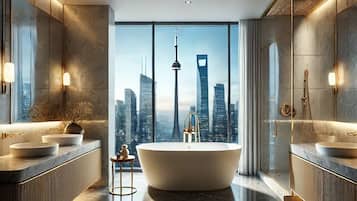 Enjoy a luxurious bathroom experience with a bathtub, two vanity sinks, and a large mirror.