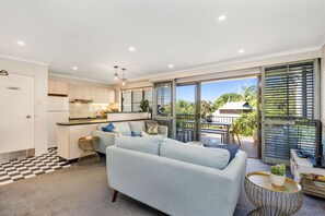Apartment (Max 4 Person) | Living area | 45-cm flat-screen TV with digital channels, TV - The Oasis Apartments and Treetop Houses (Byron Bay)