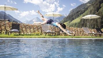 Indoor pool, outdoor pool, pool umbrellas, pool loungers