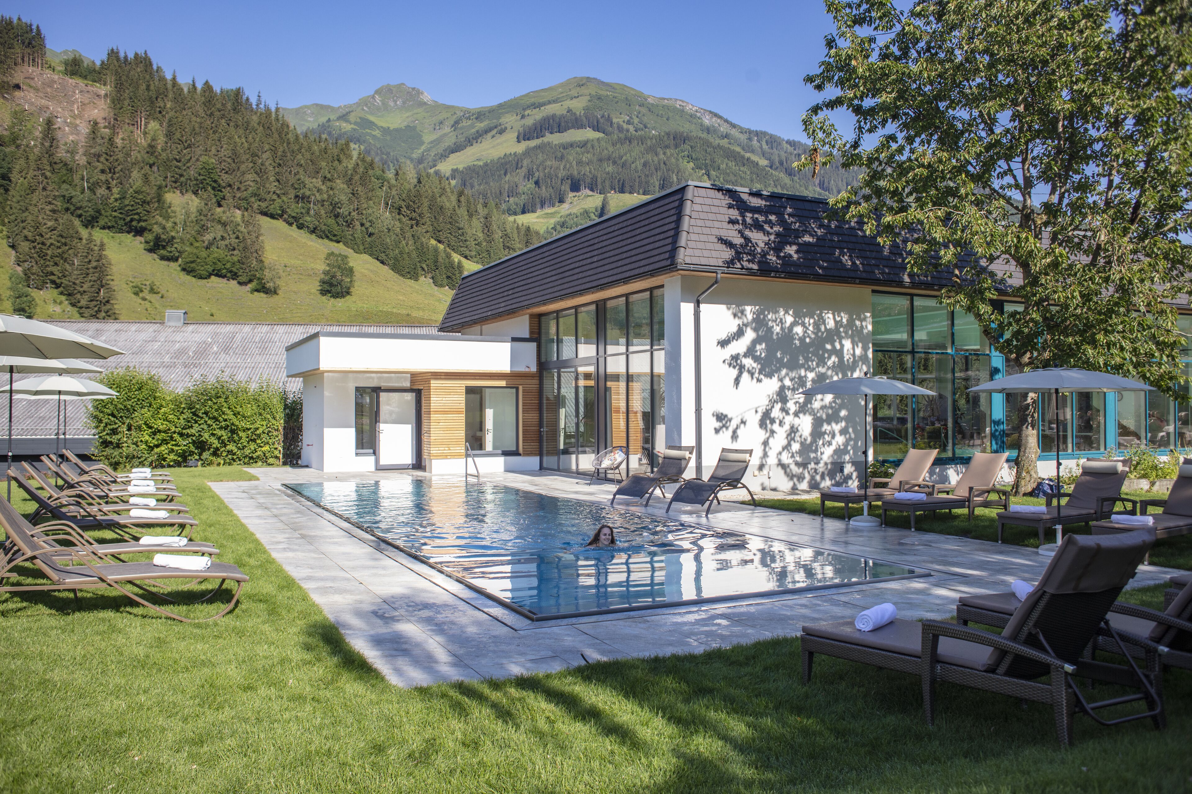 indoor pool, outdoor pool, pool umbrellas, pool loungers