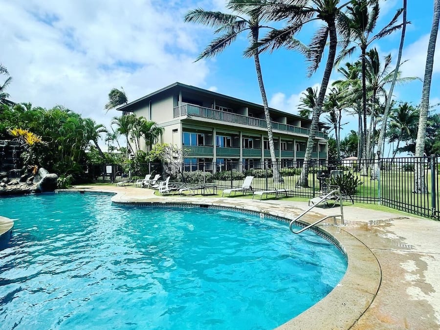 Outdoor pool, open 9:00 AM to 8:00 PM, pool umbrellas, pool loungers