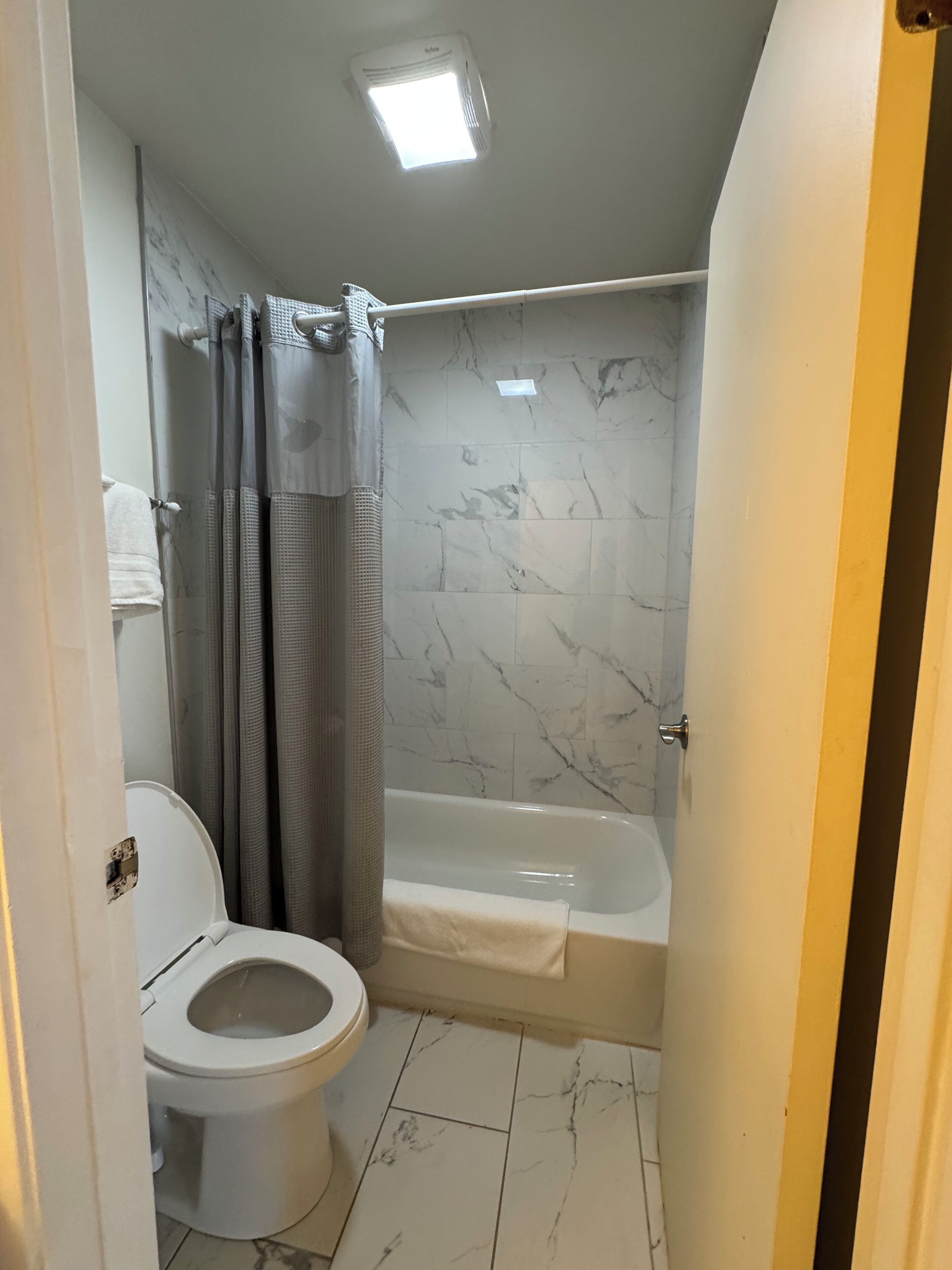 economy room, 1 queen bed, city view | bathroom | free toiletries, hair dryer, towels, soap