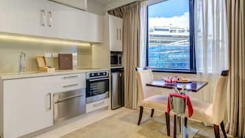 Standard King Room | Private kitchen | Fridge, microwave, electric kettle, toaster