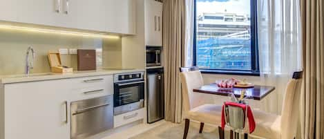 Standard King Room | Private kitchen | Fridge, microwave, electric kettle, toaster