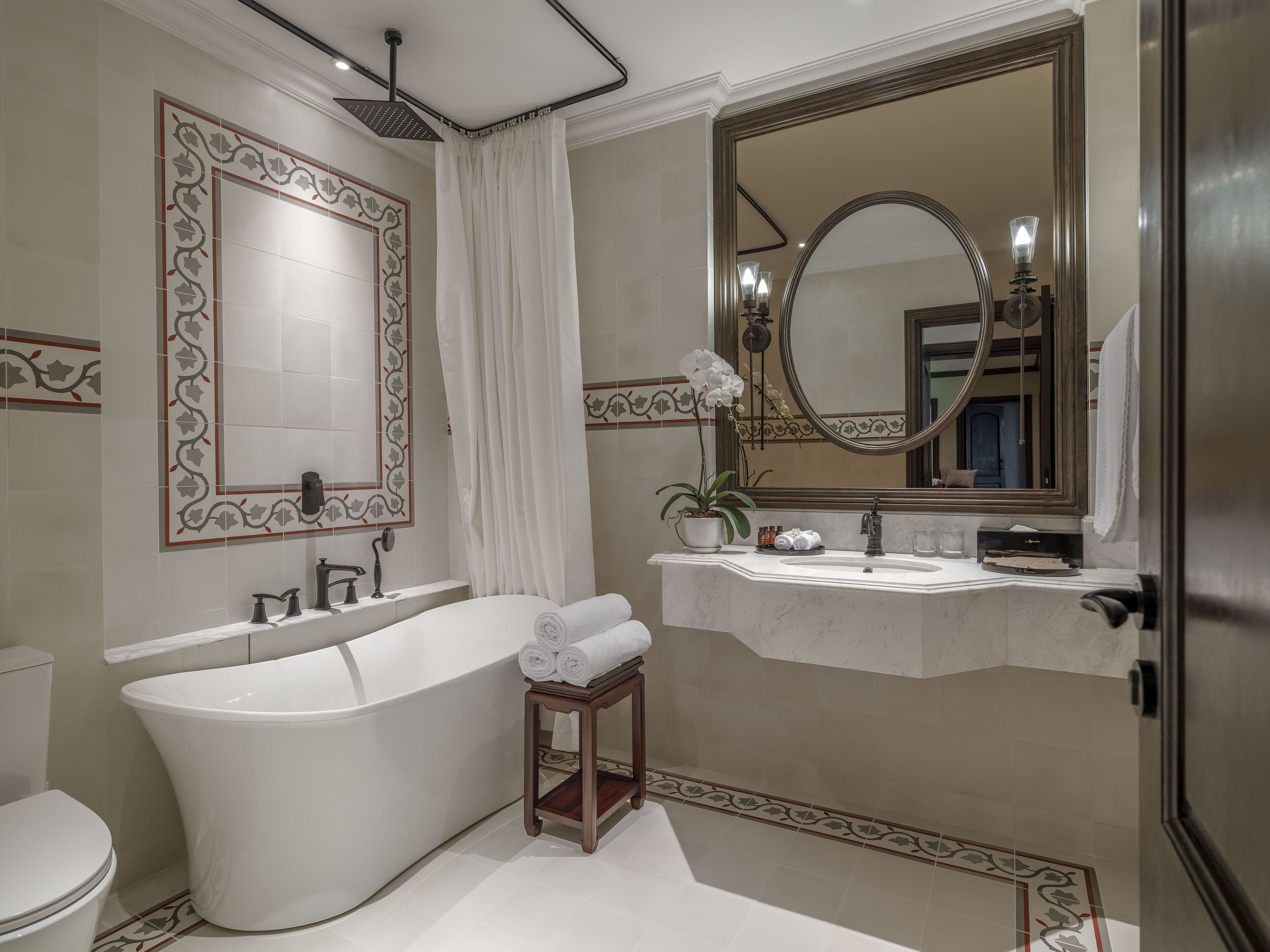 deluxe city view | bathroom | designer toiletries, hair dryer, bathrobes, slippers