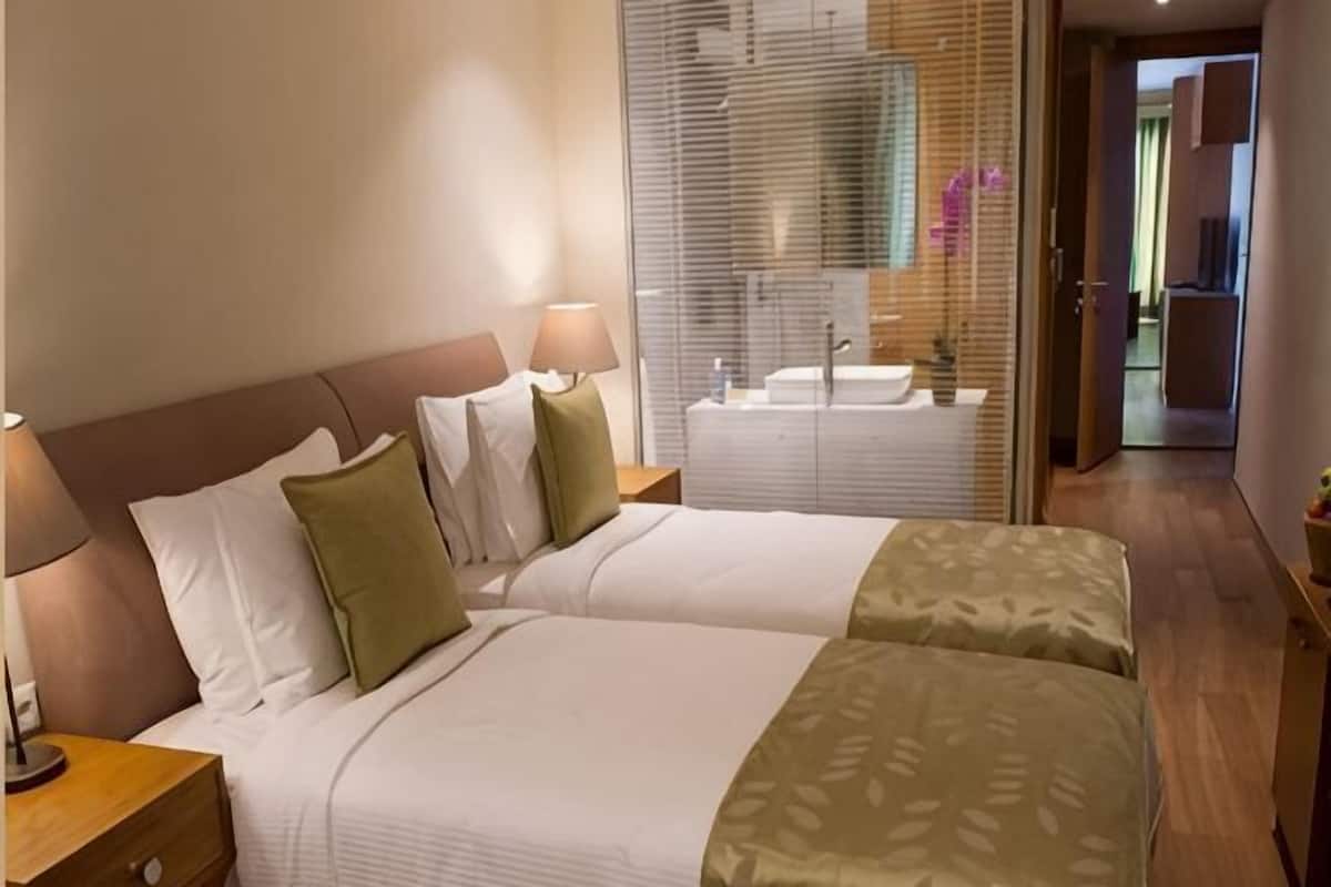 Premium bedding, pillow-top beds, minibar, in-room safe