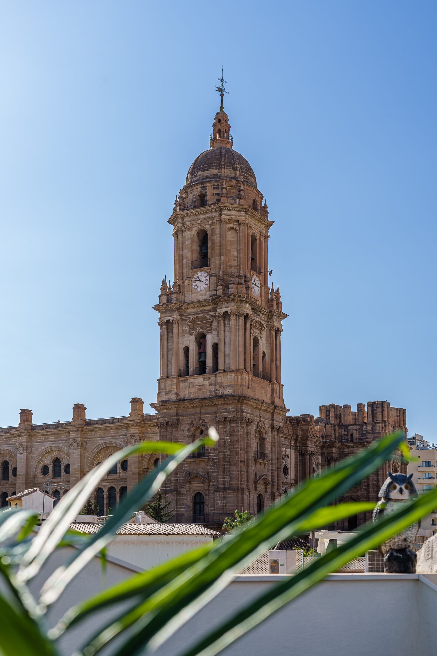 A historic building with a prominent bell tower and arched windows.