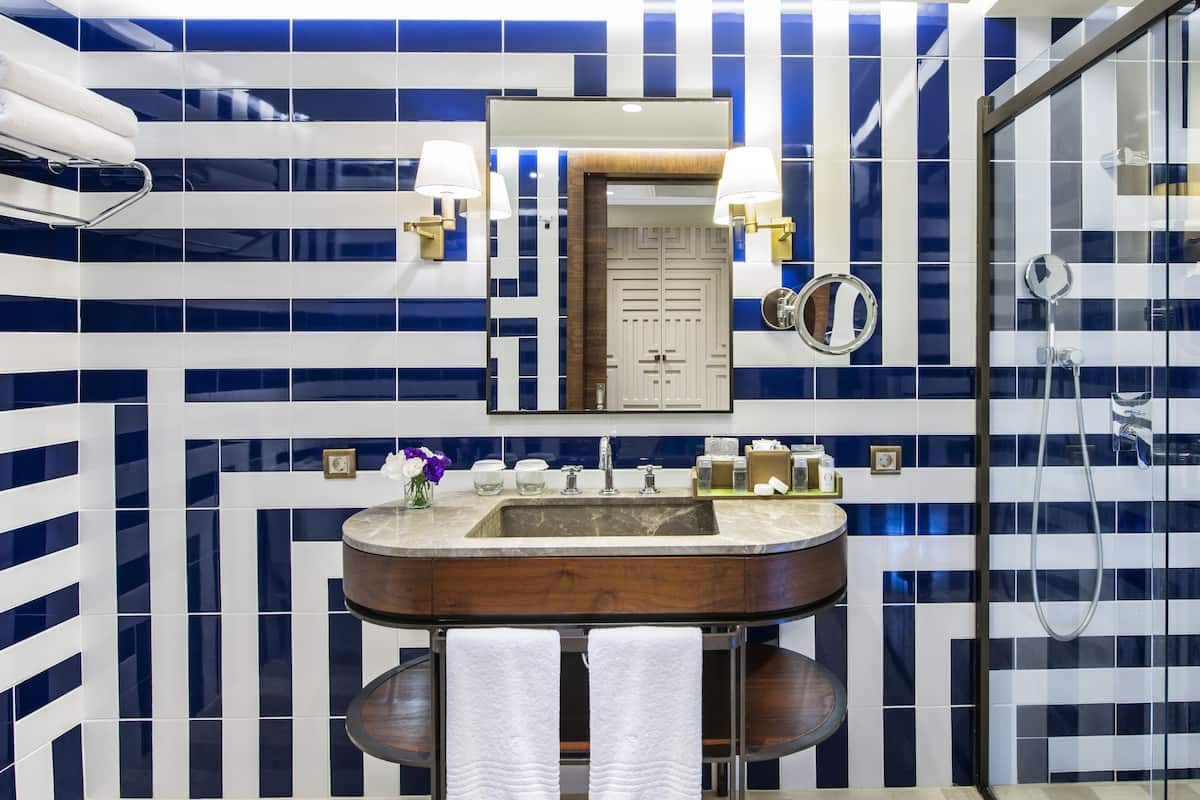 Shower, eco-friendly toiletries, hair dryer, slippers