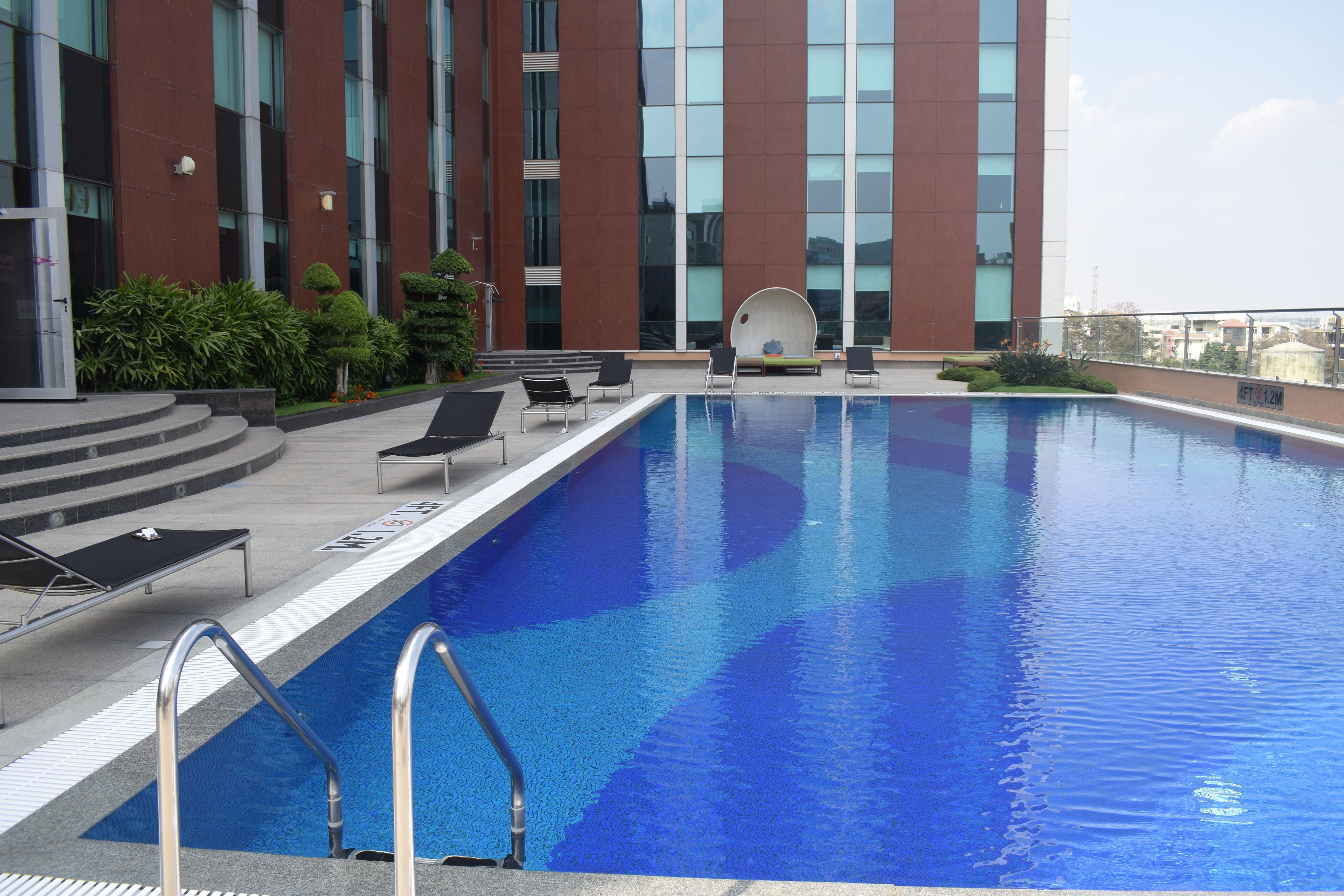 outdoor pool, pool umbrellas, pool loungers