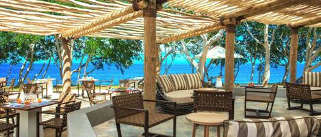 On the beach, white sand, sun loungers, beach towels