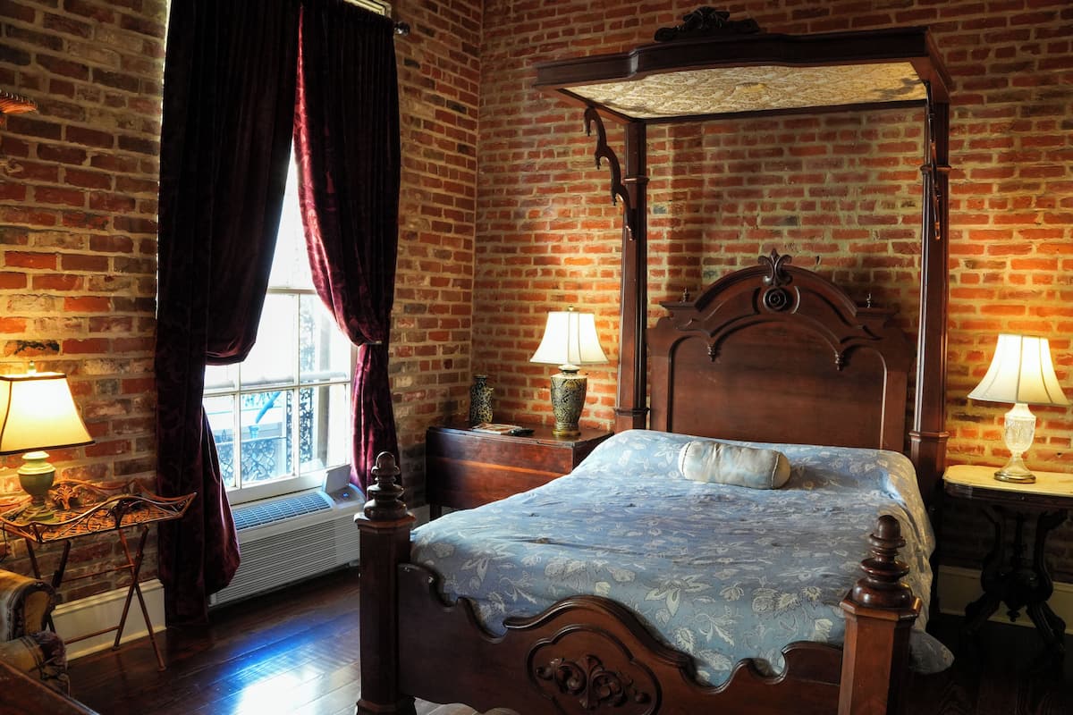 Balcony Queen | Individually decorated, individually furnished, blackout drapes