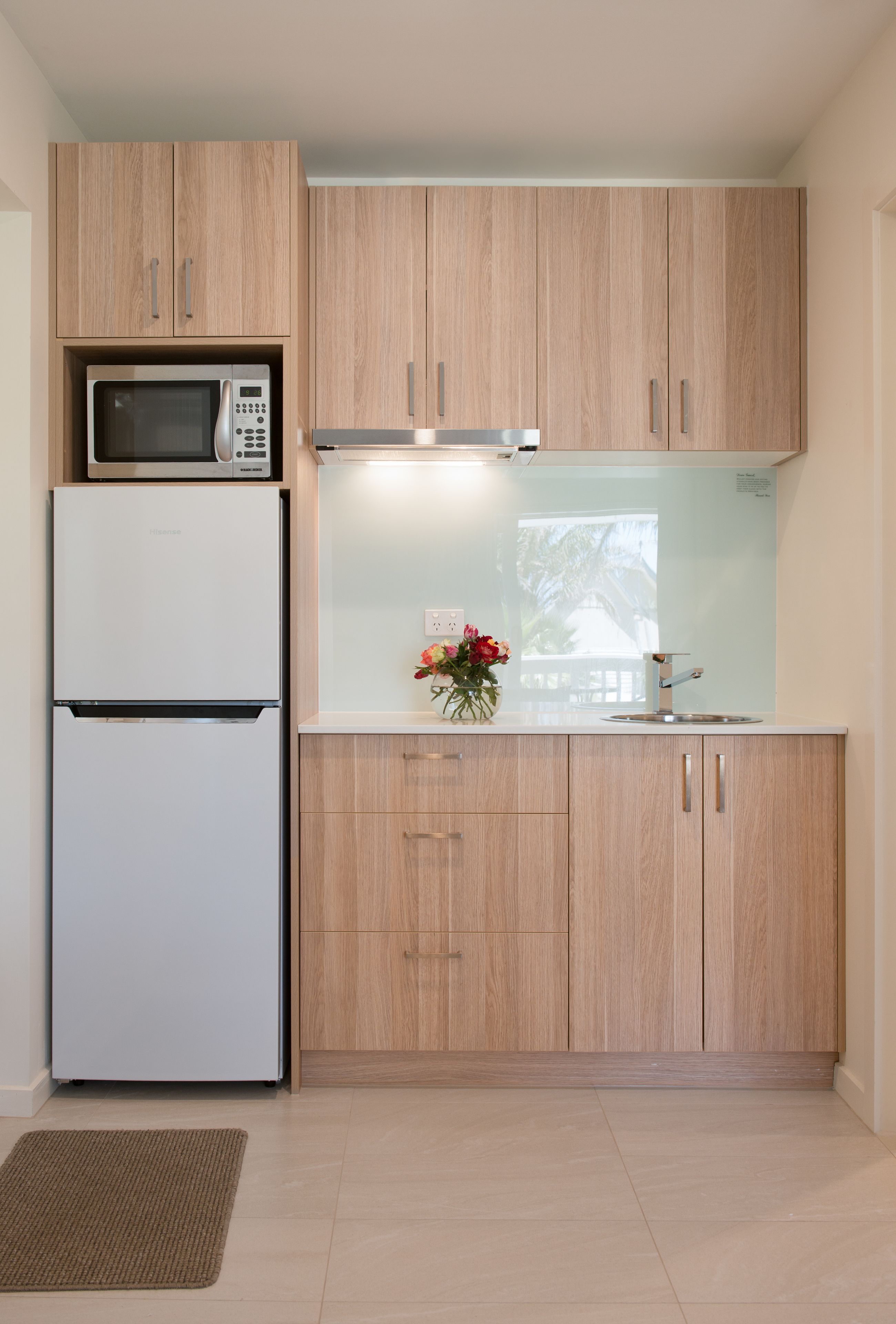 full-sized fridge, microwave, espresso maker, coffee/tea maker