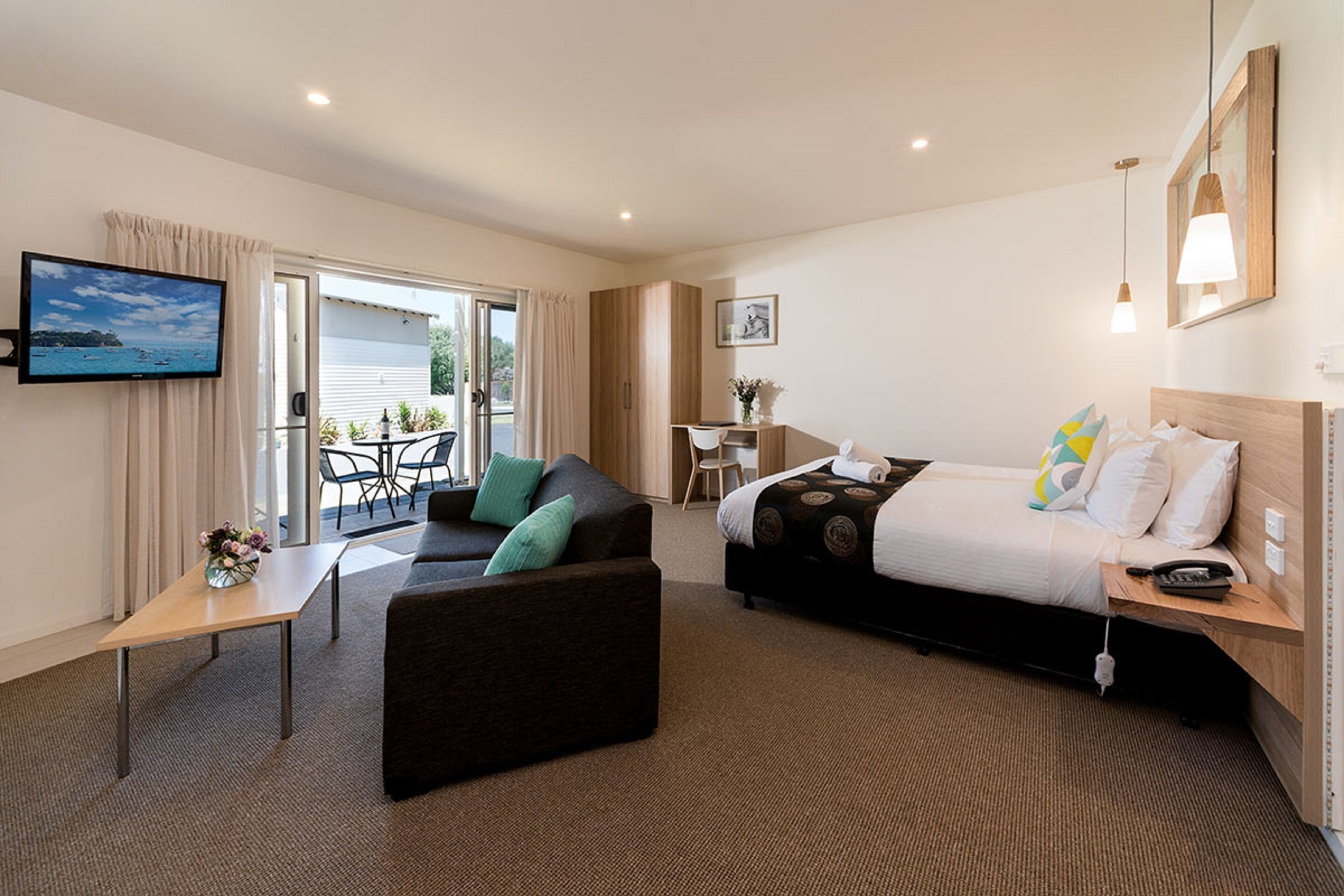 deluxe suite with free parking and wifi | pillow-top beds, laptop workspace, blackout curtains, iron/ironing board