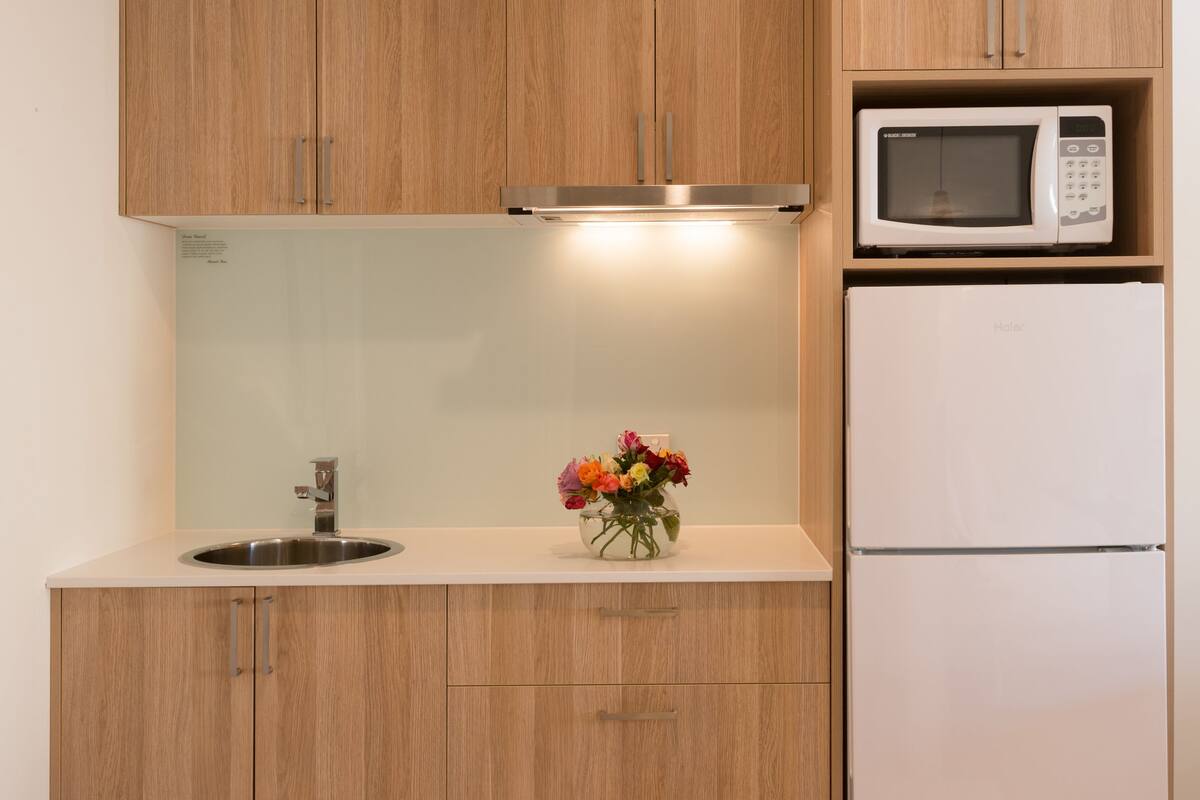 deluxe suite with free parking and wifi | private kitchenette | full-sized fridge, microwave, espresso maker, coffee/tea maker