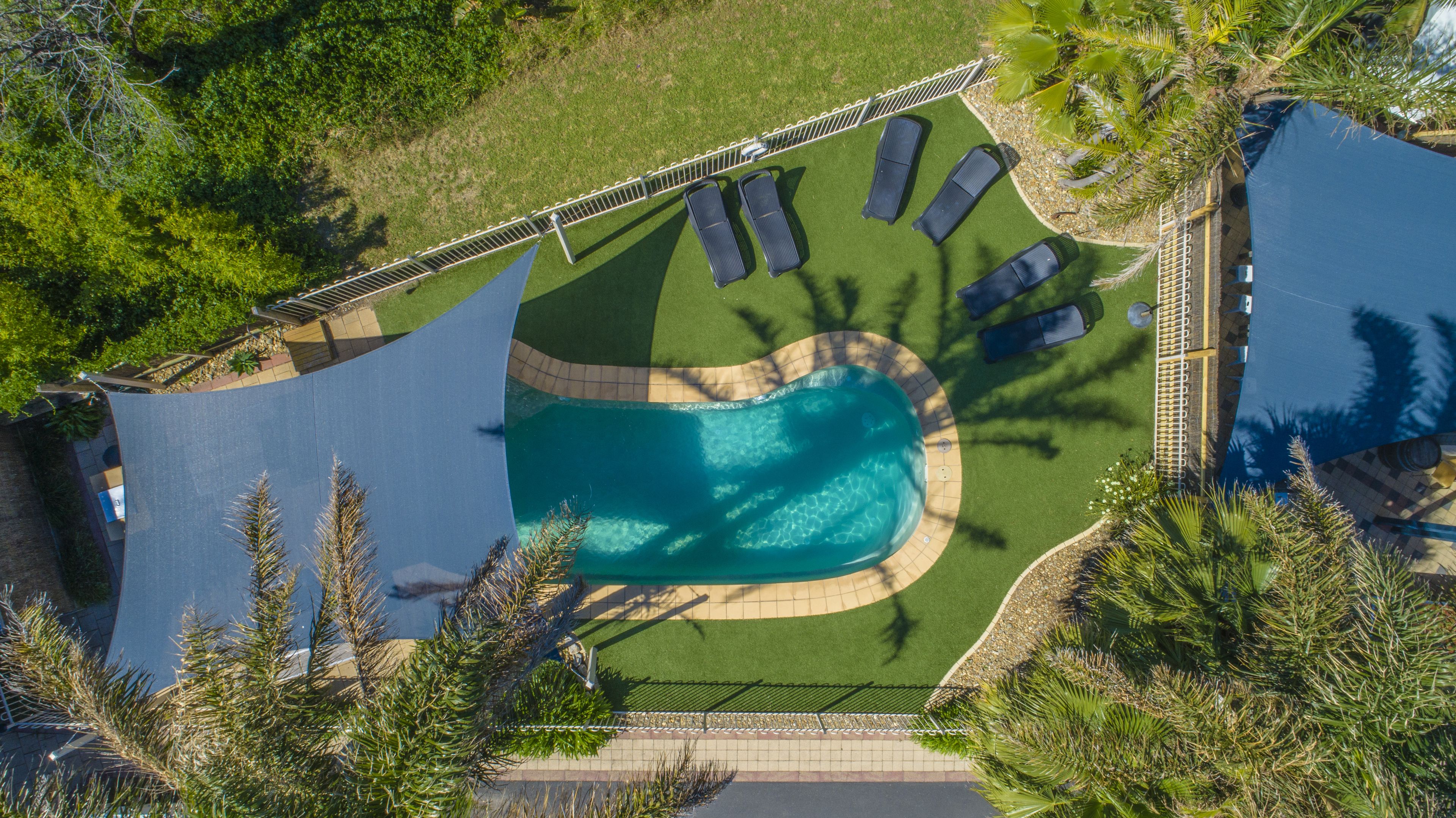 outdoor pool, pool umbrellas, pool loungers