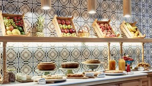 A breakfast buffet with various fruits, pastries, and beverages. - Angelina Aegina Boutique Escape (Aegina)