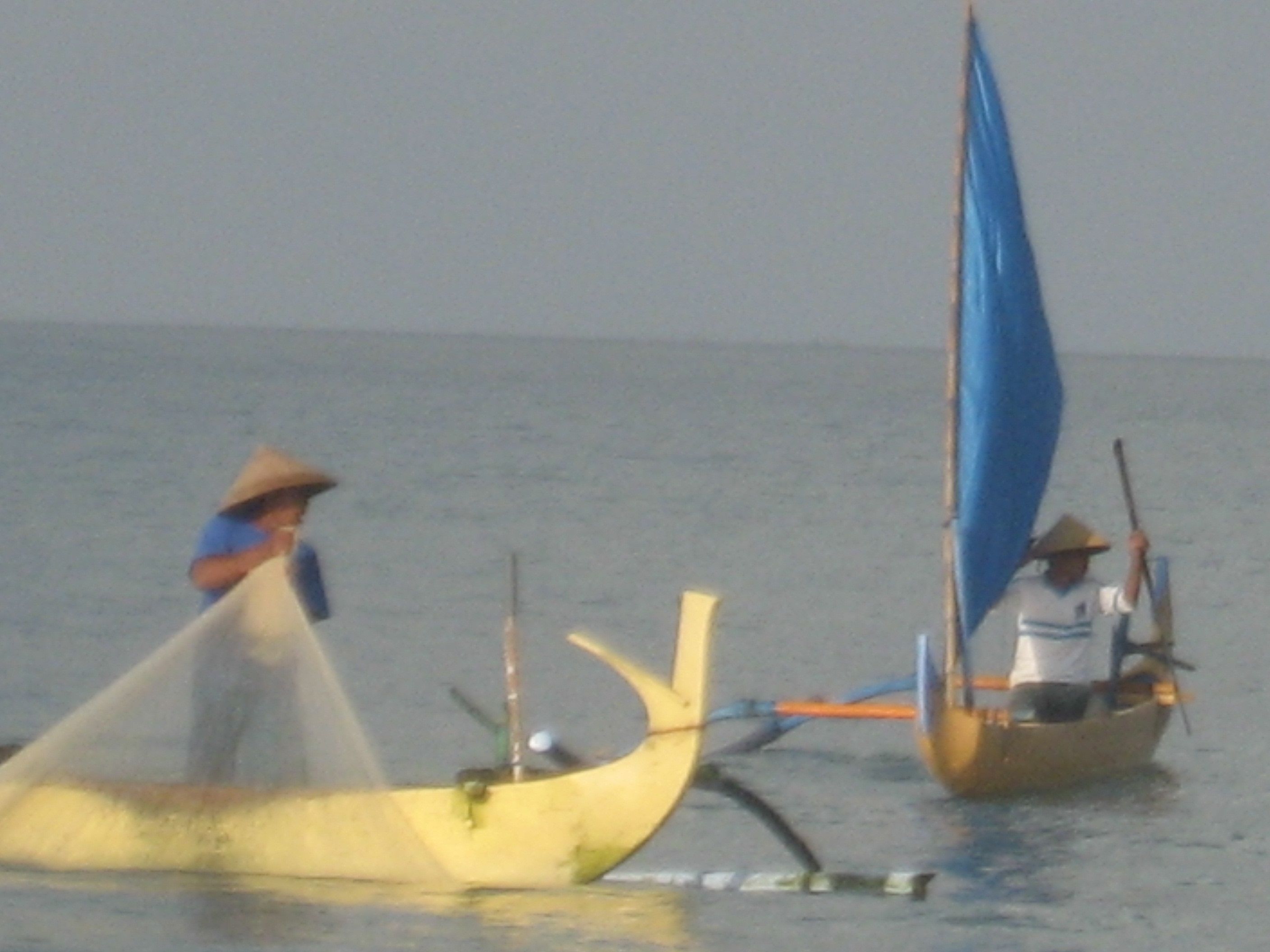 Two boats on calm water.