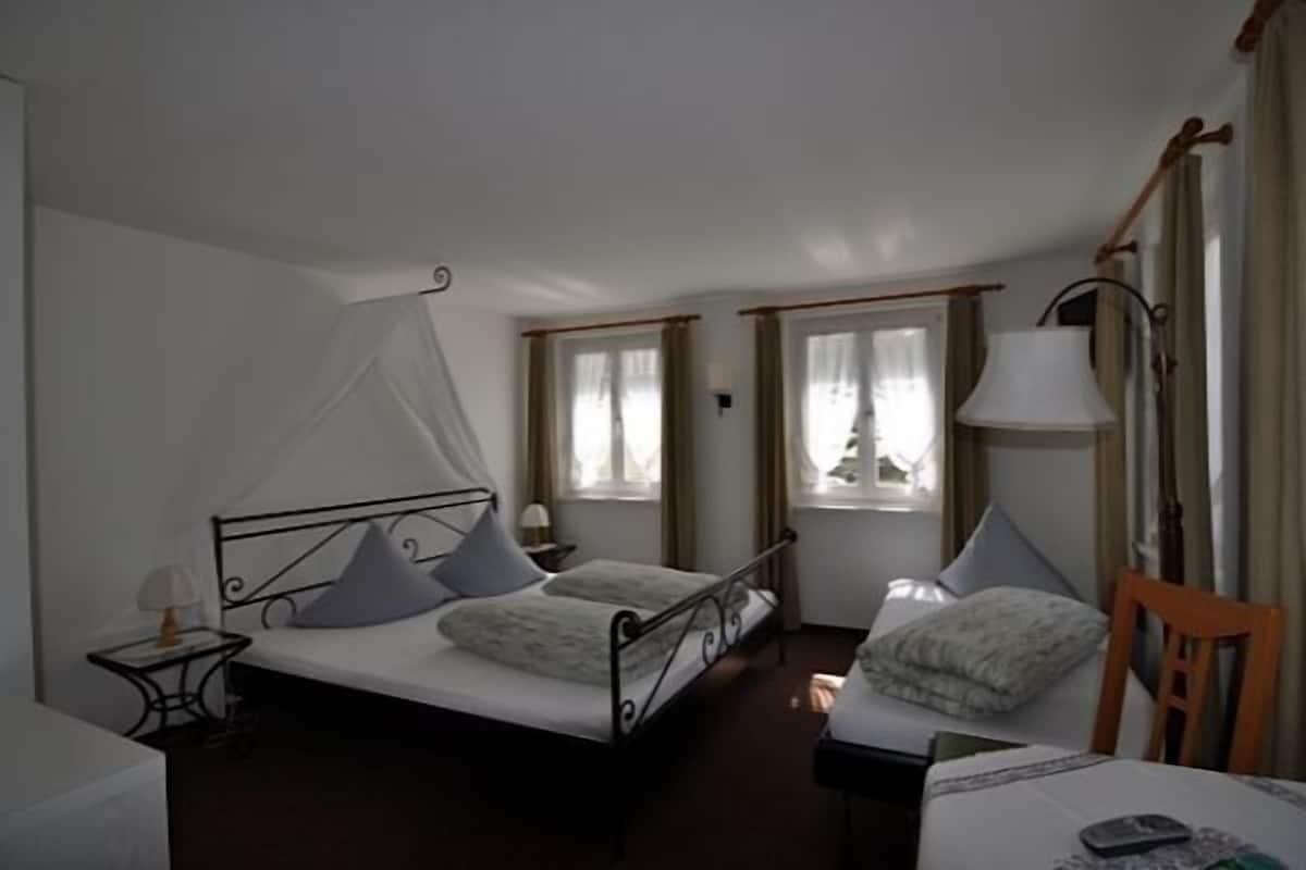Triple Room | Individually furnished, blackout drapes, free cribs/infant beds