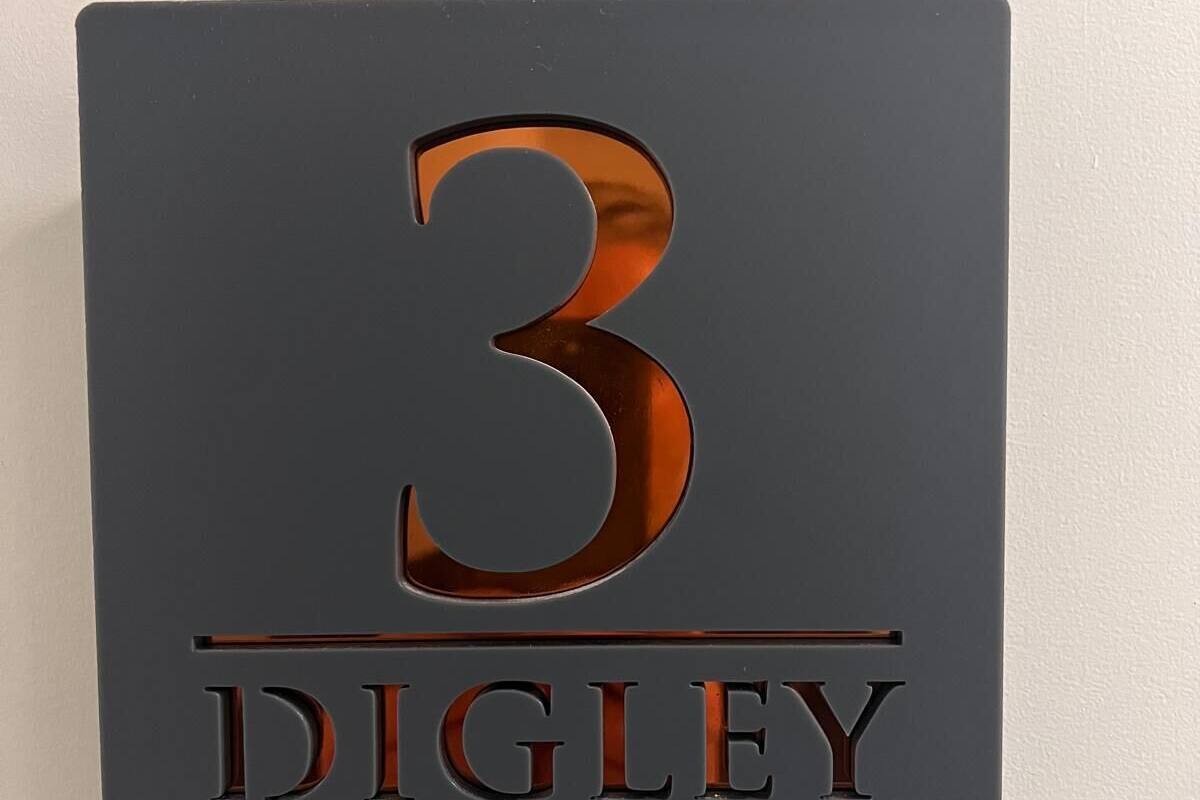 A sign with the number 3 and the name DIGLEY on it.