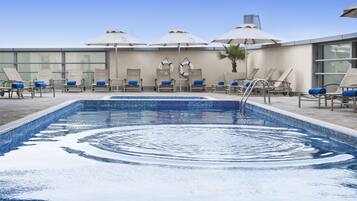 Outdoor pool, open 7:00 AM to 7:00 PM, pool umbrellas, pool loungers