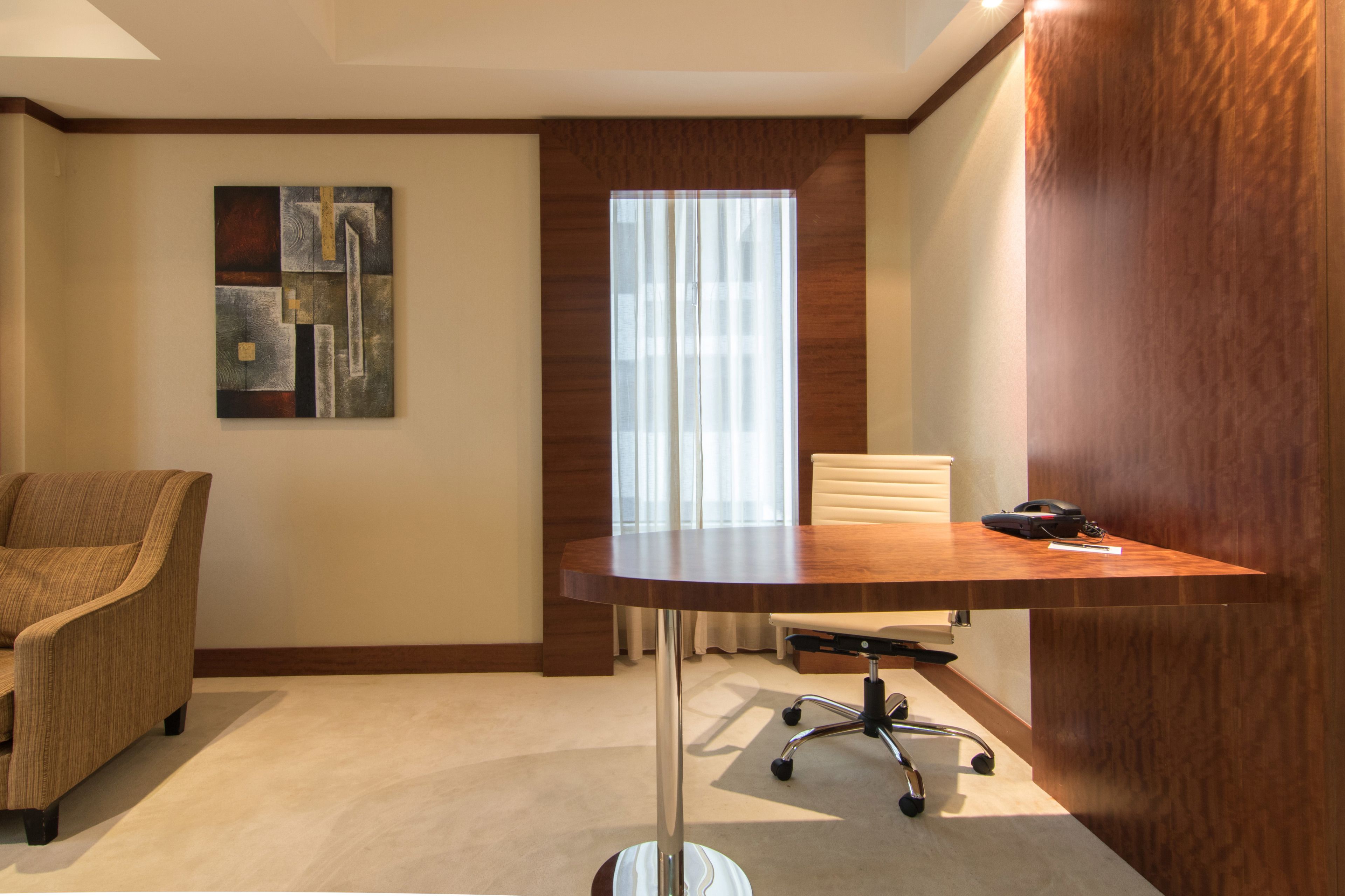 deluxe two bedroom suite | living area | 22-inch lcd tv with satellite channels, tv