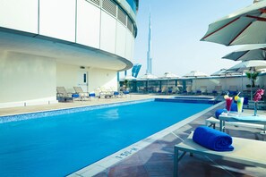 Outdoor pool, open 7:00 AM to 7:00 PM, pool umbrellas, pool loungers - Carlton Downtown (Dubai)