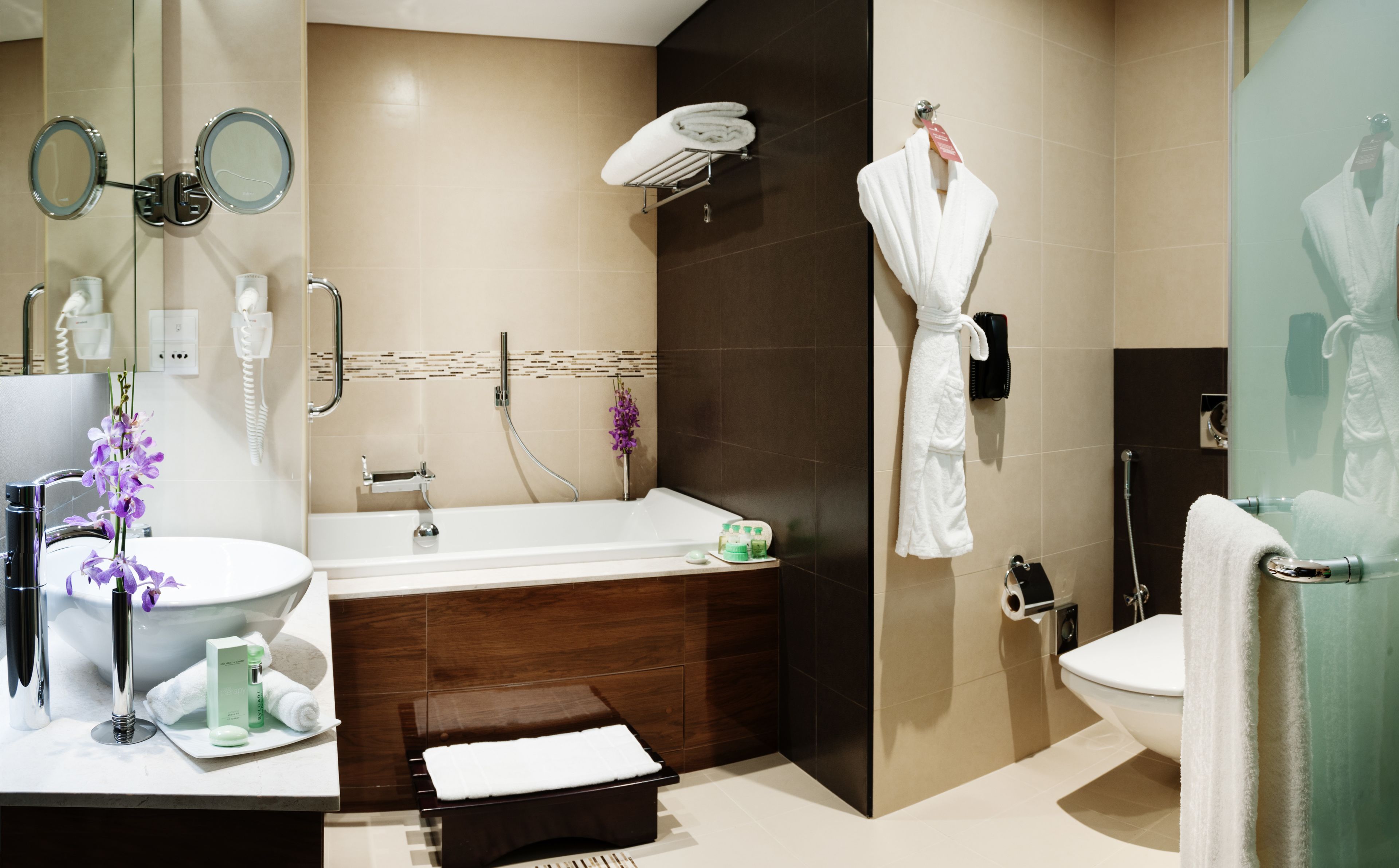 combined shower/bathtub, deep-soaking bathtub, designer toiletries