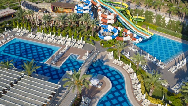A resort with multiple swimming pools, a water park, and a beach area. - Royal Alhambra Palace – All Inclusive (Manavgat)