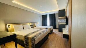 Standard Triple Room | Minibar, in-room safe, soundproofing, free WiFi