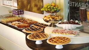 A buffet with various baked goods, pies, and fruits. - Philadelphia (Cattolica)