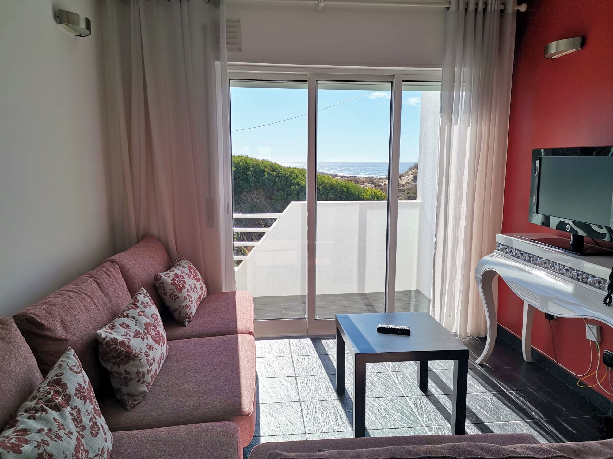 Apartment, Sea View | Living area | 50-inch LCD TV with satellite channels