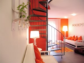 Superior Apartment | Living area | 50-inch LCD TV with satellite channels