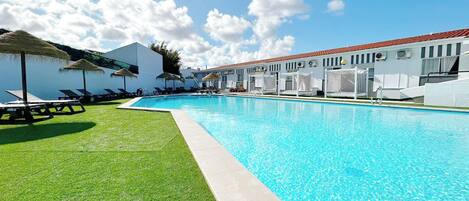 Indoor pool, outdoor pool, pool umbrellas, sun loungers