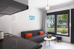 Design Apartment, 1 Double Bed with Sofa bed, Pool Access, Partial Sea View | Living room | TV - Agni Suites (Lefkada)