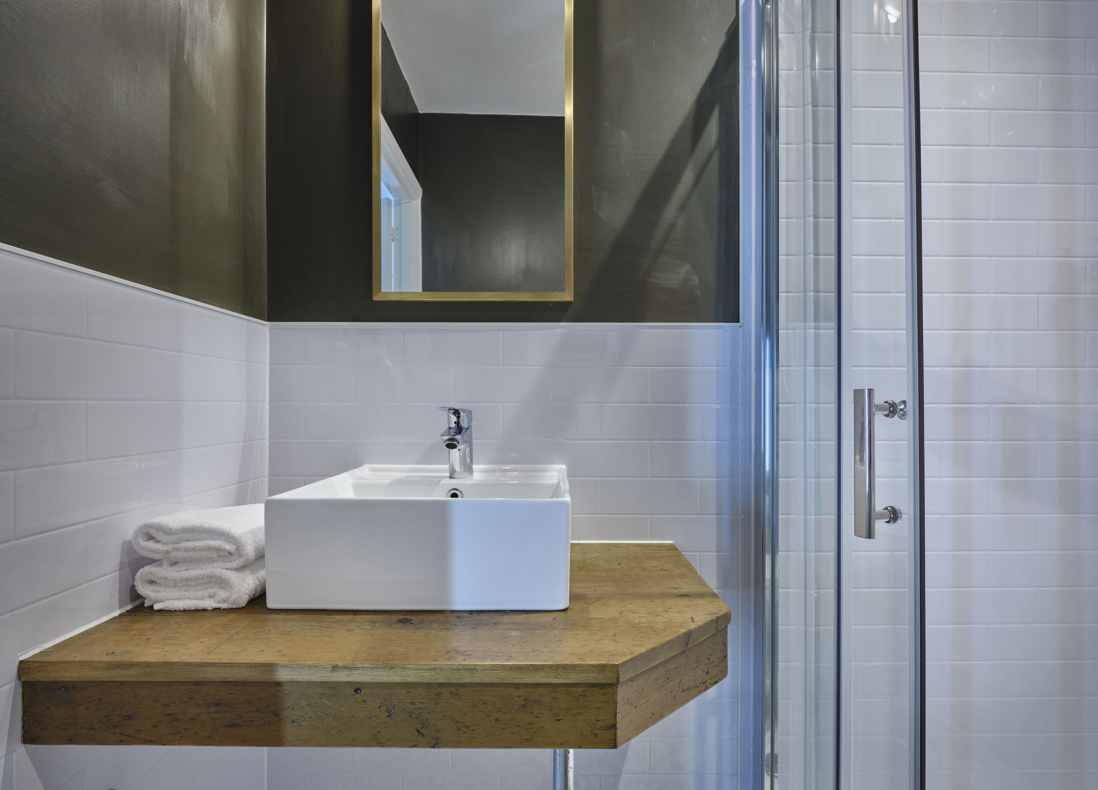 deluxe double room | bathroom | shower, eco-friendly toiletries, hair dryer, towels