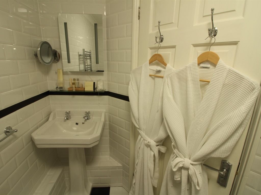 Shower, hair dryer, bathrobes, towels