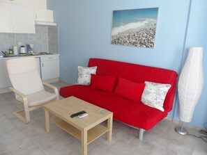 Apartment, 2 Bedrooms, Partial Sea View | Living room | Plasma TV, table tennis - Seafront Studios & Apartments (Chios)