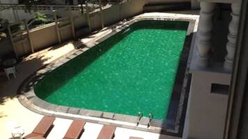 Outdoor pool, pool umbrellas, sun loungers