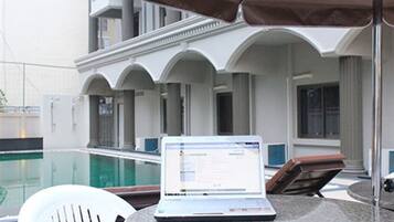 Outdoor pool, pool umbrellas, sun loungers