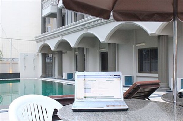 Outdoor pool, pool umbrellas, pool loungers