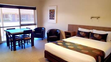 Laptop workspace, blackout curtains, iron/ironing board