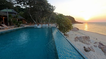 Outdoor pool, open 7 AM to 7 PM, pool umbrellas, pool loungers