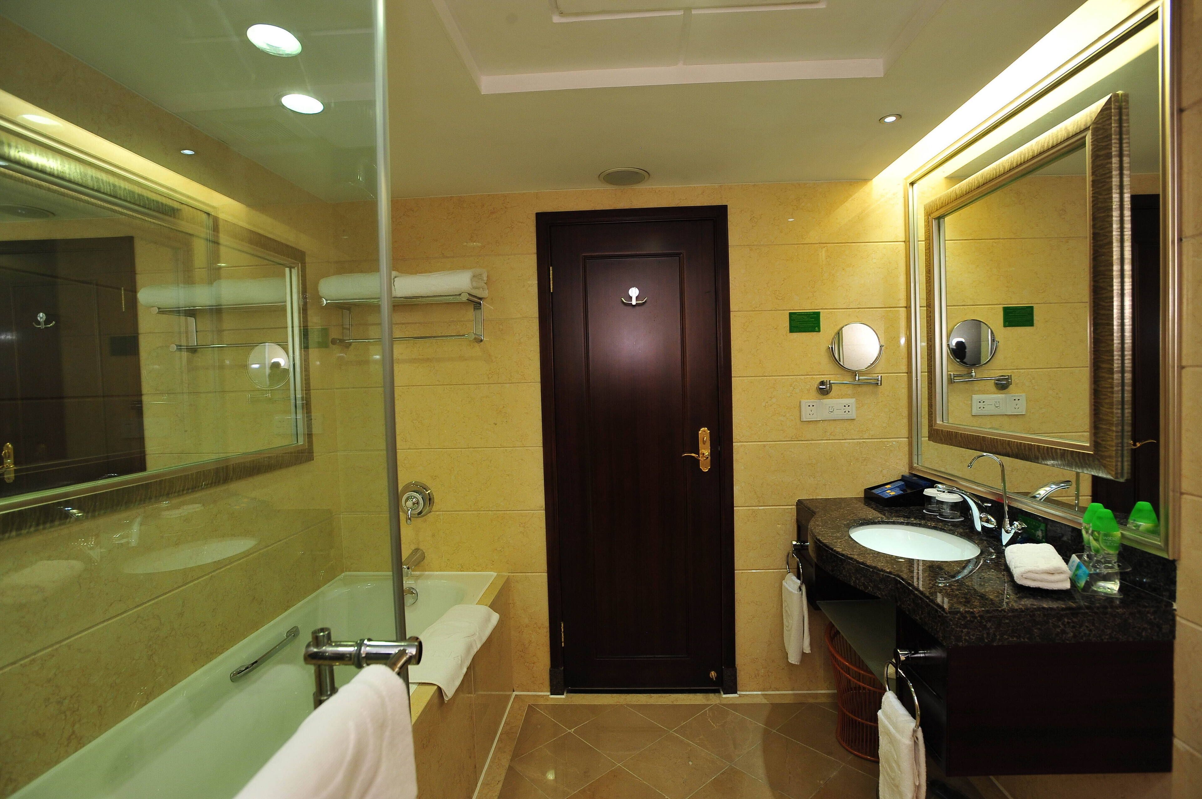 Business Suite | Bathroom | Rainfall showerhead, hair dryer, bathrobes, towels