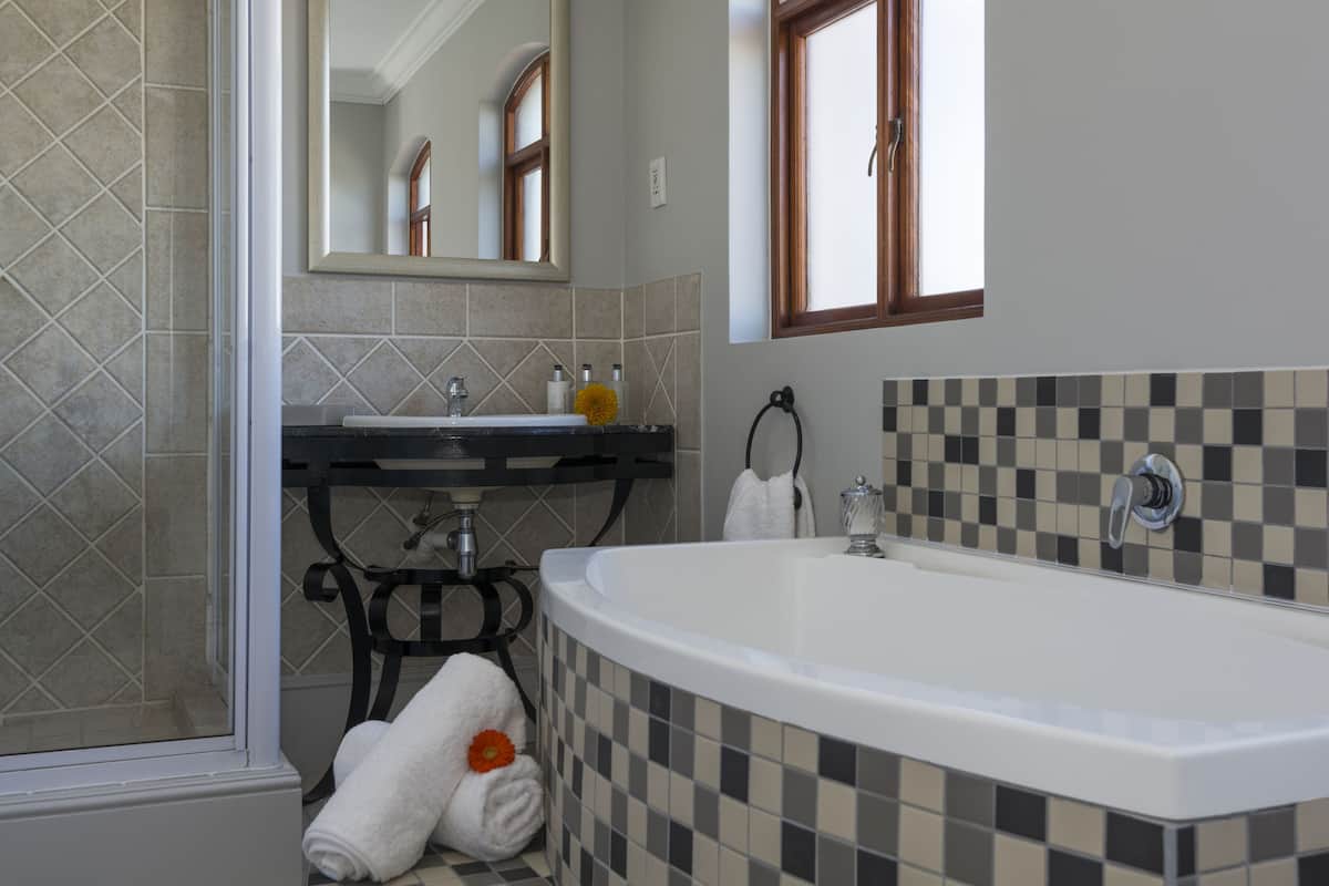 superior suite | bathroom | free toiletries, hair dryer, slippers, towels