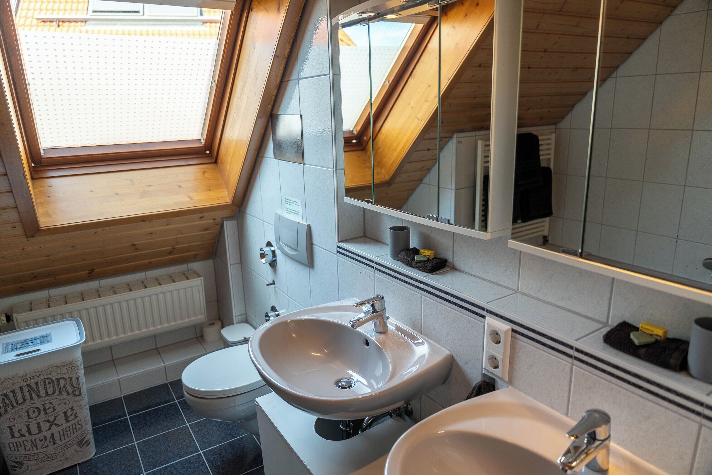 family apartment | bathroom | hair dryer, towels, soap, shampoo