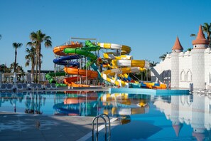 Relax by the pool and enjoy the adjacent water park with multiple slides and lounge chairs.